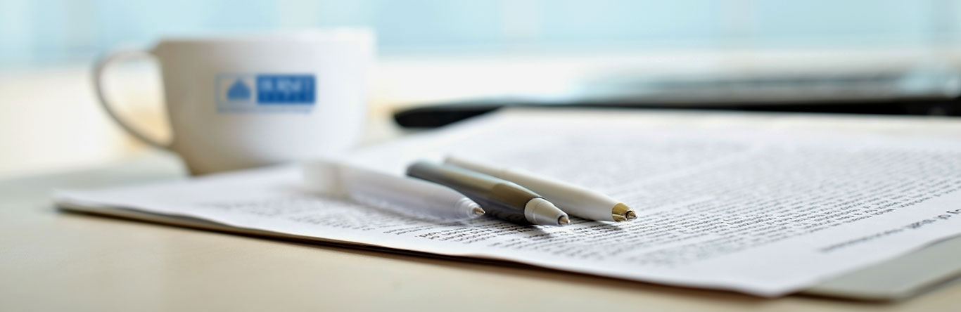 pens mug and paperwork